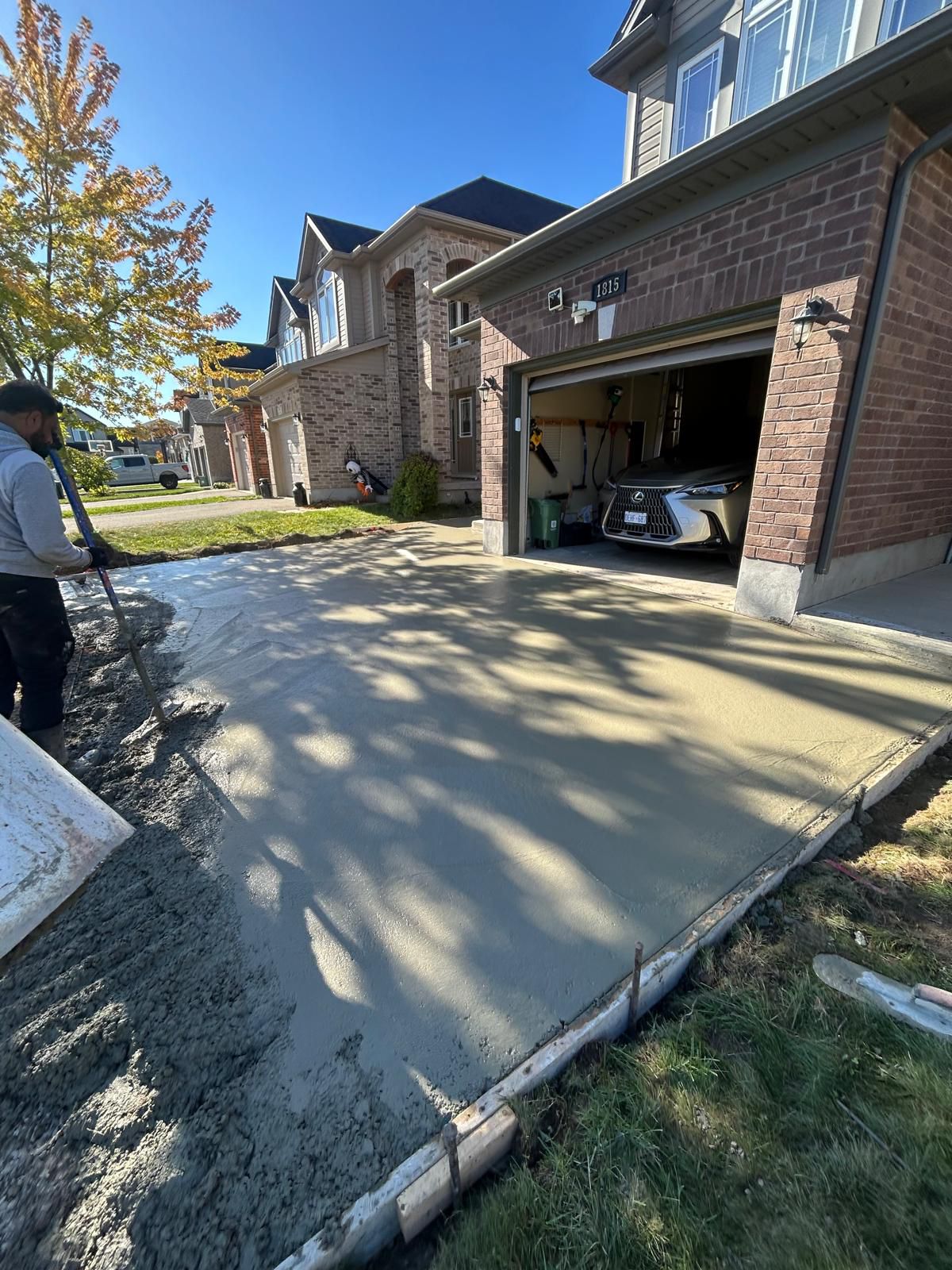 TenStateBuilds concrete crew working on a residential driveway in Kitchener Ontario